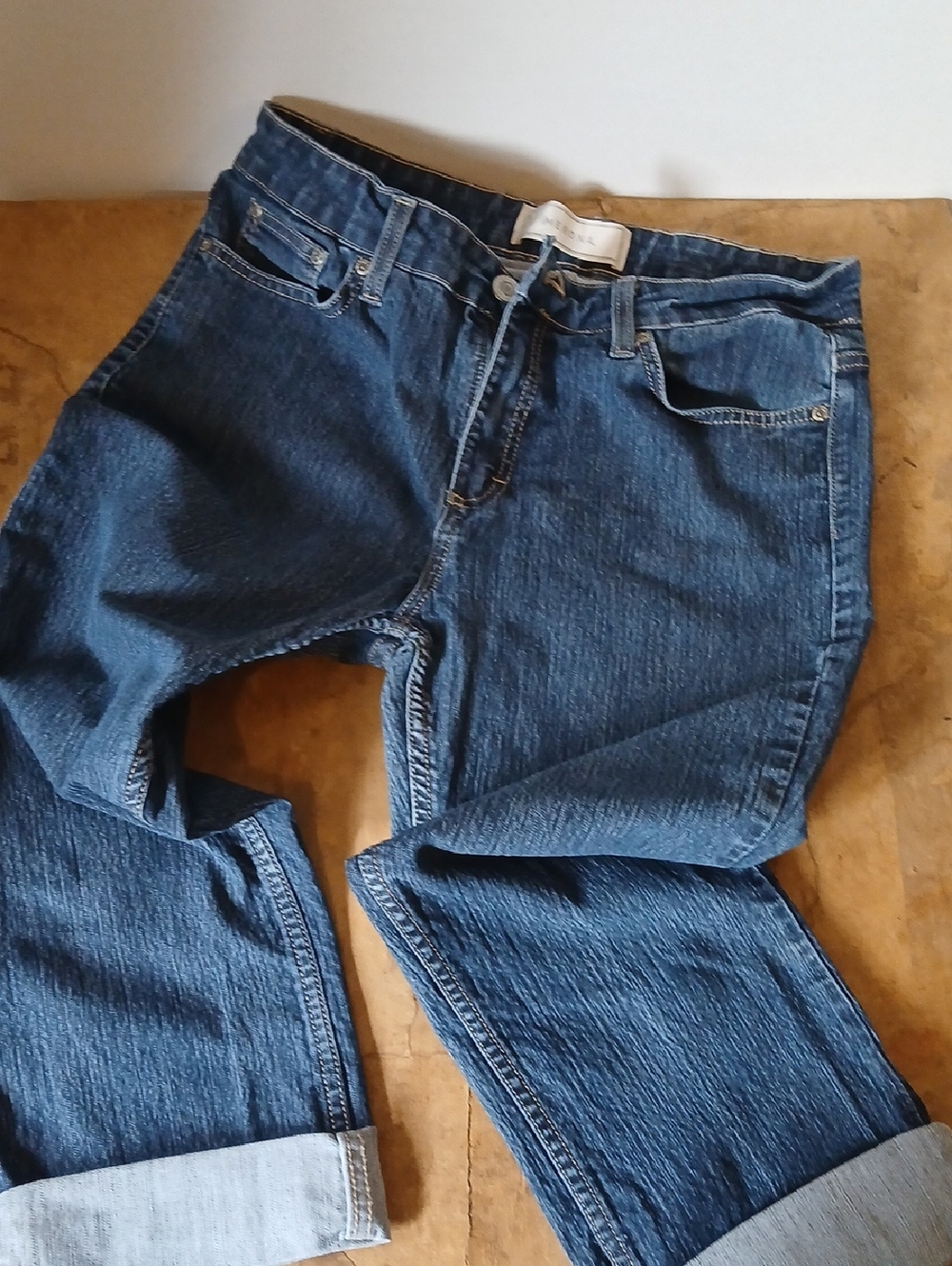 Merona light blue denim jeans with tan stitching